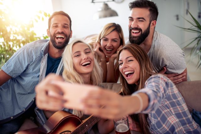 Friends at home laughing