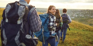 Friends walking together on a sunny spring hike