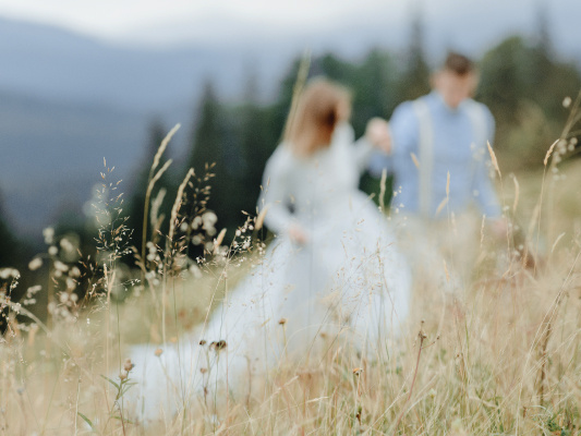 bride and groom on a mountainside