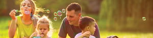 family-in-spring-blowing-bubbles