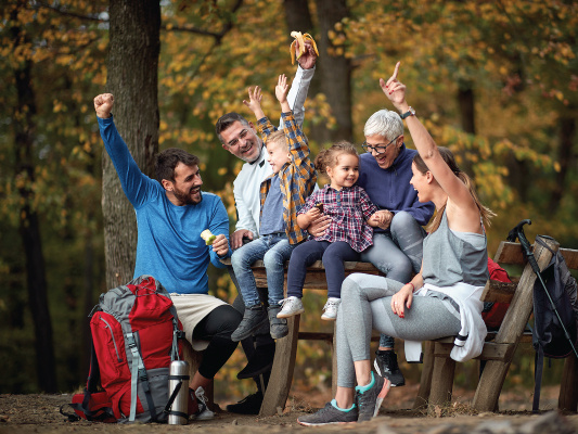 family happy hiking in fall