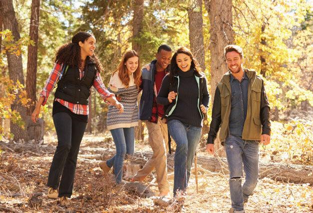 happy friends hiking in autumn
