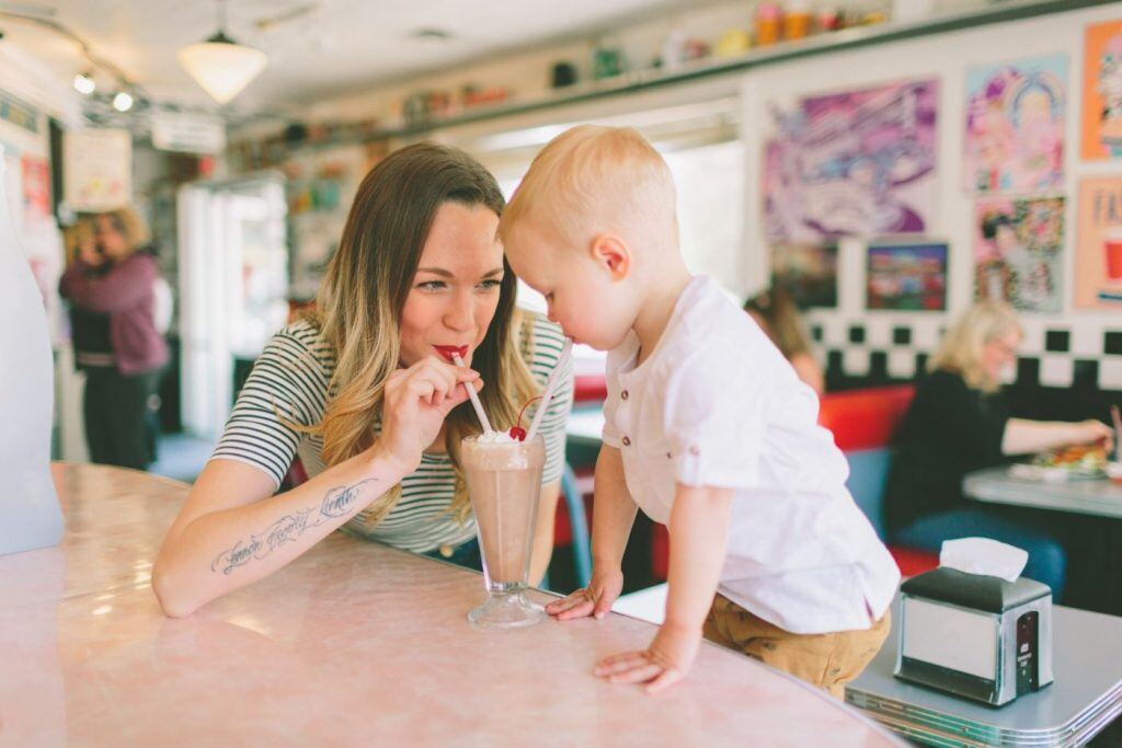 ice cream boy mother toddler son mom diner sharing sundae ice cream mothers day frozen dessert