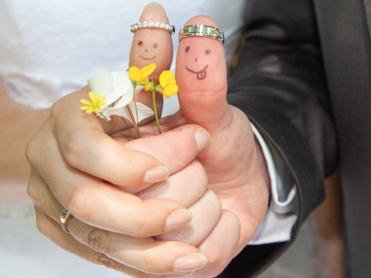 couple with rings on thumbs fun