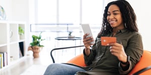 person-happily-paying-for-something-online