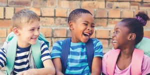 happy school kids with backpacks