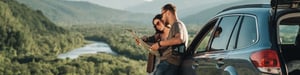 two-people-standing-by-car