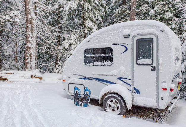 Winter camper with snowshoes