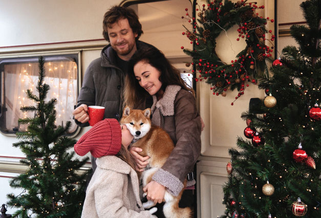 winter-family-and-pet-enjoying-camper
