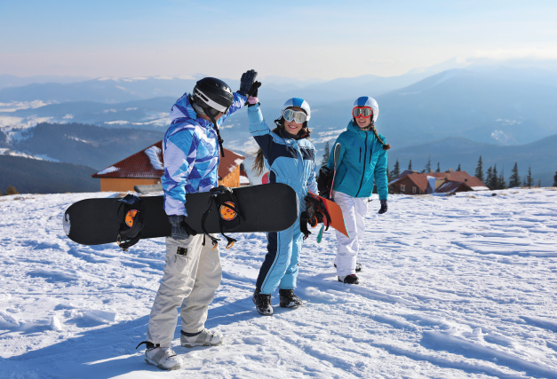 winter high-five snowboarding