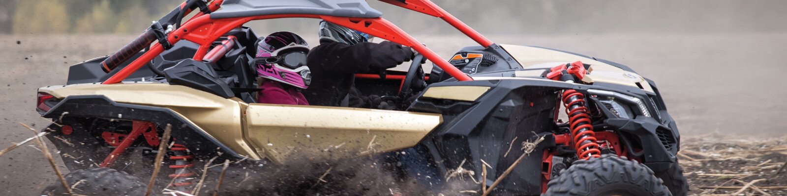 offroading in a UTV spraying mud