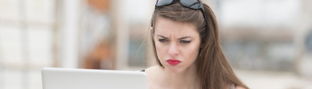 woman looking at her credit report upset