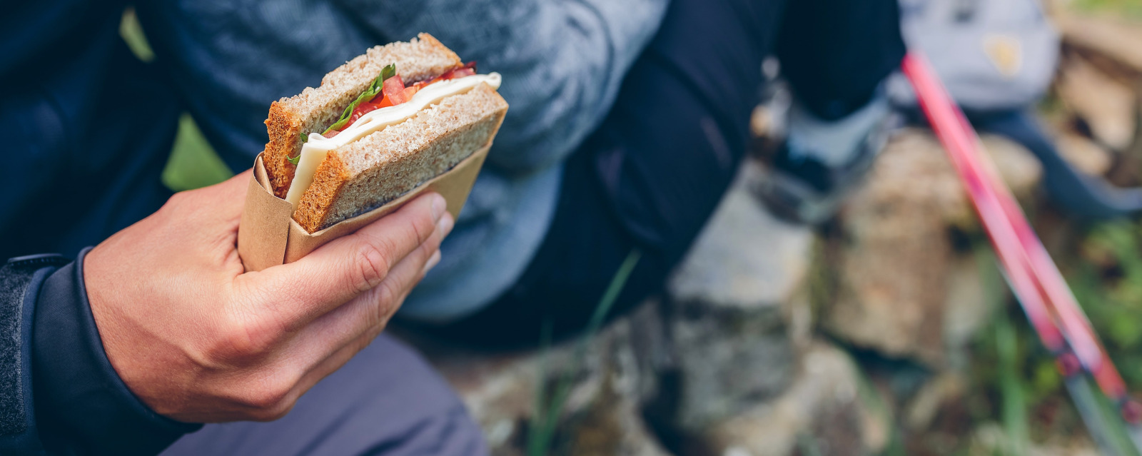 camping person eating sandwich